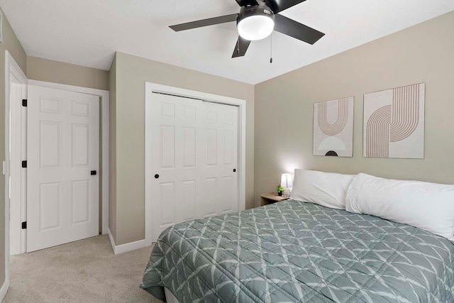 77 Emerson Ave W, West Saint Paul, MN 55118 - bedroom featuring light carpet, a closet, baseboards, and a ceiling fan