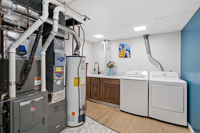 77 Emerson Ave W, West Saint Paul, MN 55118 - washroom featuring cabinet space, gas water heater, and separate washer and dryer