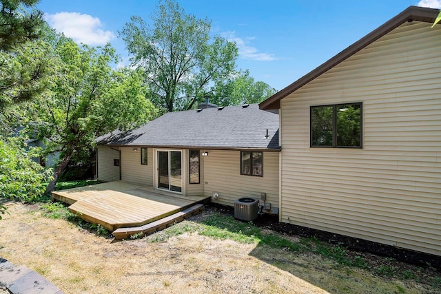 77 Emerson Ave W, West Saint Paul, MN 55118 - back of house with a wooden deck, central air condition unit, and roof with shingles