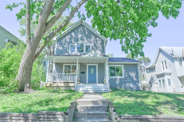 2714 18th Ave S, Minneapolis, MN 55407 - view of front of home featuring a porch and a front lawn