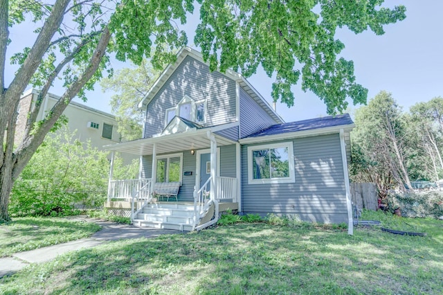 2714 18th Ave S, Minneapolis, MN 55407 - view of front facade with a porch and a front yard