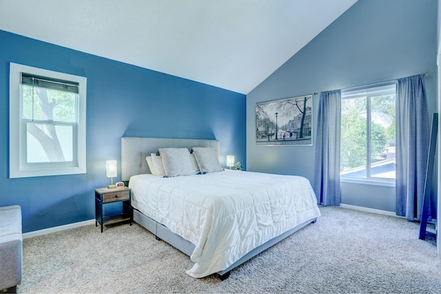 2714 18th Ave S, Minneapolis, MN 55407 - carpeted bedroom with baseboards, multiple windows, and lofted ceiling