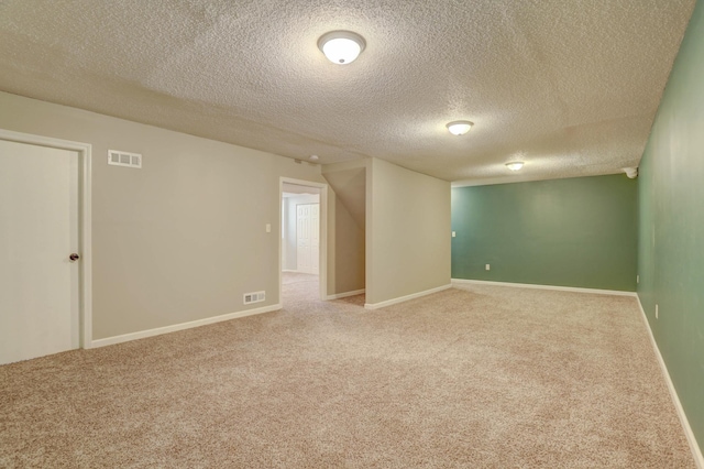 2714 18th Ave S, Minneapolis, MN 55407 - unfurnished room with carpet flooring, a textured ceiling, and baseboards