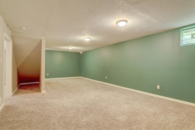 2714 18th Ave S, Minneapolis, MN 55407 - basement with carpet floors, a textured ceiling, and baseboards
