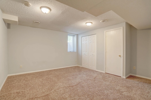 2714 18th Ave S, Minneapolis, MN 55407 - unfurnished bedroom featuring carpet, a textured ceiling, baseboards, and a closet