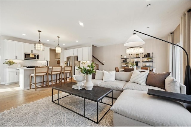 10391 Glacier Ln N, Maple Grove, MN 55369 - living area featuring light wood finished floors and recessed lighting