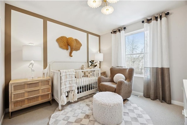 10391 Glacier Ln N, Maple Grove, MN 55369 - carpeted bedroom with baseboards and a nursery area
