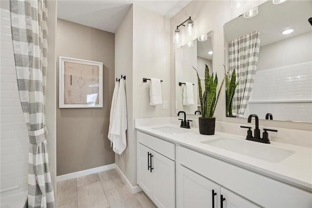 10391 Glacier Ln N, Maple Grove, MN 55369 - bathroom featuring baseboards, double vanity, and a shower with curtain