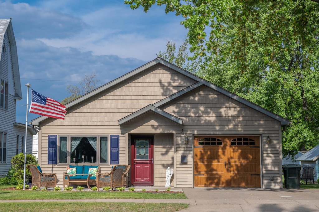215 Harriman Ave N, Amery, WI 54001 - view of front of property with a garage and concrete driveway