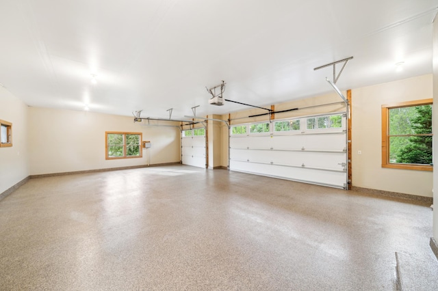 garage featuring baseboards and a garage door opener