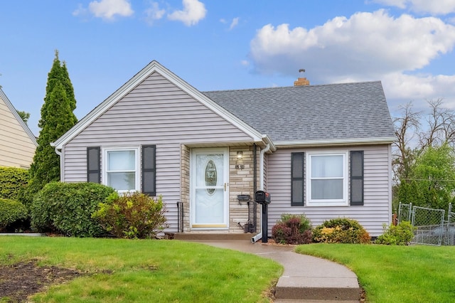 1224 Grotto St N, Saint Paul, MN 55117 - bungalow-style home with a chimney, roof with shingles, and stone siding