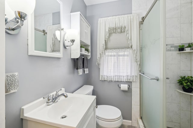 1224 Grotto St N, Saint Paul, MN 55117 - bathroom with a stall shower, toilet, and vanity