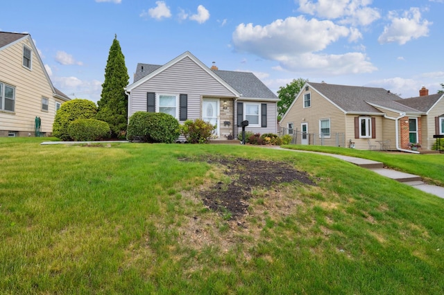 1224 Grotto St N, Saint Paul, MN 55117 - view of front of home featuring a front yard and a chimney
