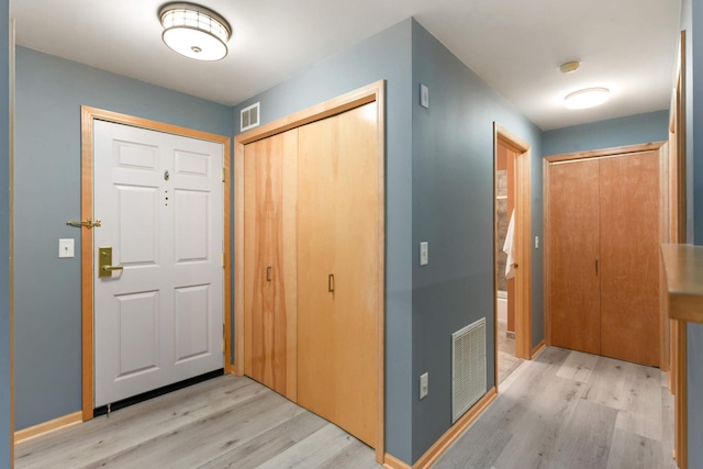 foyer entrance with wood finished floors