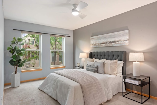 bedroom with baseboards, carpet, and ceiling fan