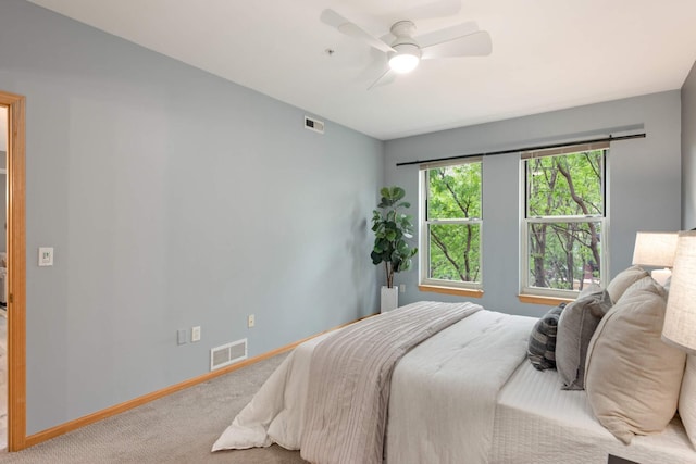 bedroom featuring carpet flooring, baseboards, and a ceiling fan