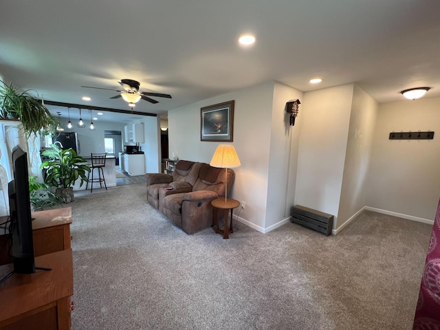225 State St, Buhl, MN 55713 - carpeted living area with ceiling fan, baseboards, recessed lighting, and a fireplace