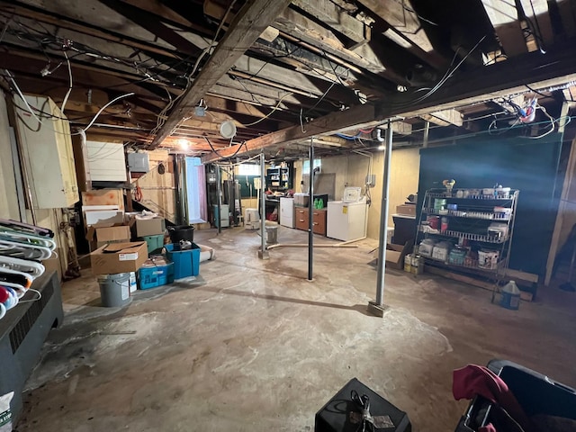225 State St, Buhl, MN 55713 - unfinished below grade area featuring washer and clothes dryer