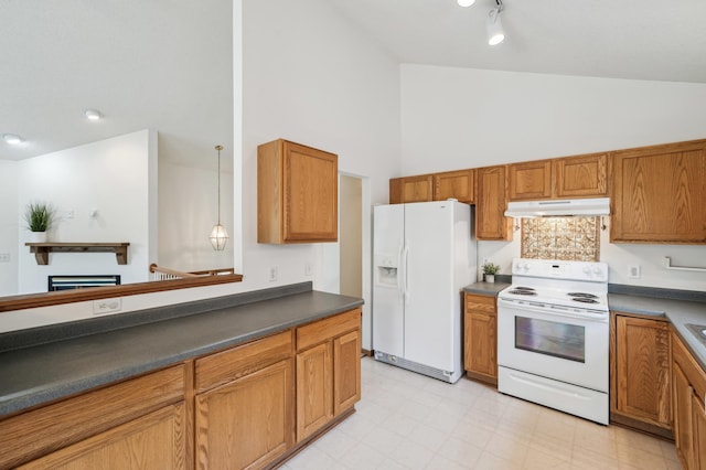 7379 Devin Ln, Shakopee, MN 55379 - kitchen featuring white appliances, under cabinet range hood, dark countertops, high vaulted ceiling, and brown cabinetry