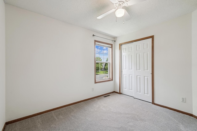 7379 Devin Ln, Shakopee, MN 55379 - unfurnished bedroom featuring light colored carpet, baseboards, a closet, and a textured ceiling