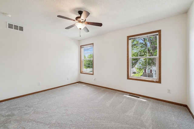 7379 Devin Ln, Shakopee, MN 55379 - spare room with carpet, baseboards, a textured ceiling, ceiling fan, and a smoke detector