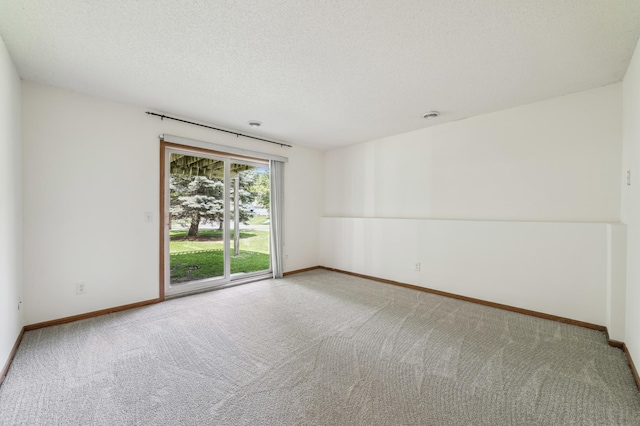 7379 Devin Ln, Shakopee, MN 55379 - carpeted spare room featuring baseboards and a textured ceiling