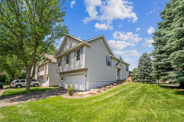 7379 Devin Ln, Shakopee, MN 55379 - view of home's exterior with asphalt driveway, a garage, and a lawn
