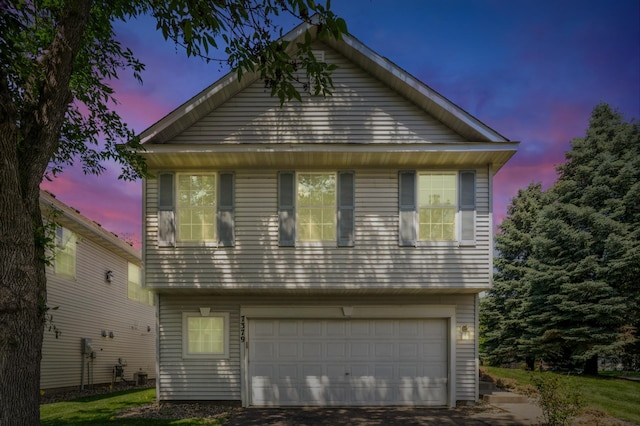 7379 Devin Ln, Shakopee, MN 55379 - view of front of house featuring an attached garage and asphalt driveway