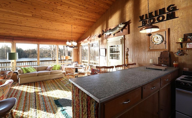 6565 White Pine Ln, Biwabik Twp, MN 55741 - kitchen featuring vaulted ceiling, stove, wood ceiling, dark countertops, and a chandelier