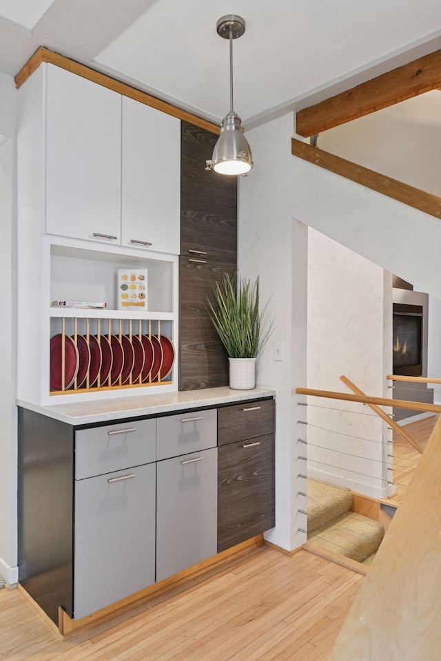 5016 Shady Oak Rd S, Minnetonka, MN 55343 - kitchen with light wood finished floors, light countertops, decorative light fixtures, and open shelves
