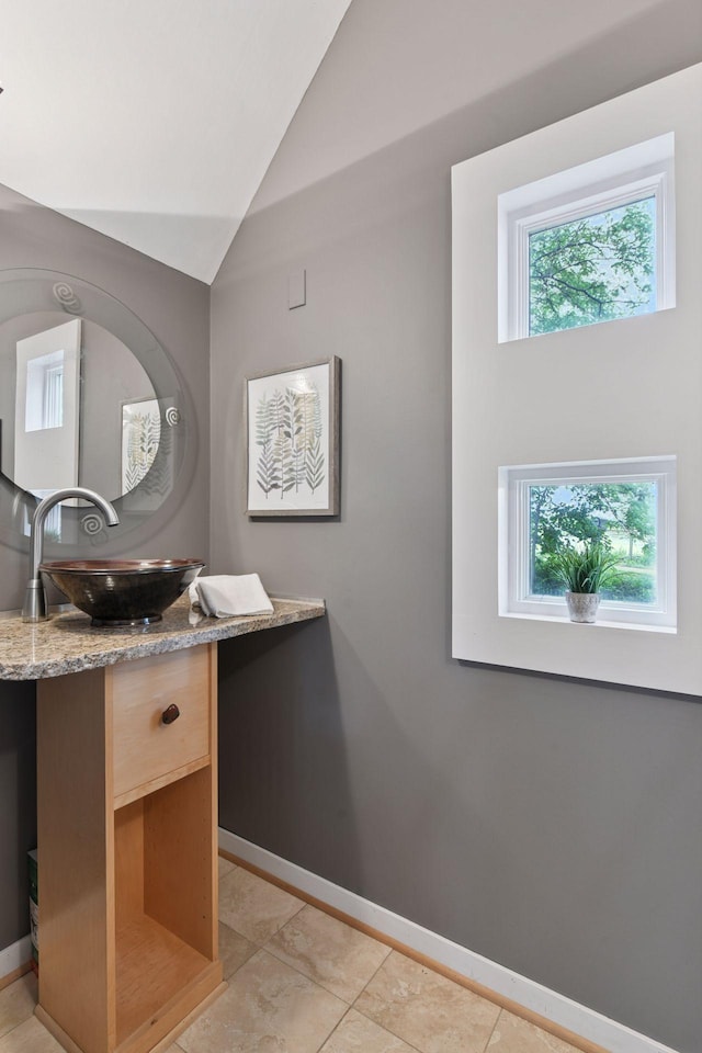 5016 Shady Oak Rd S, Minnetonka, MN 55343 - bathroom featuring vanity, baseboards, vaulted ceiling, and tile patterned flooring