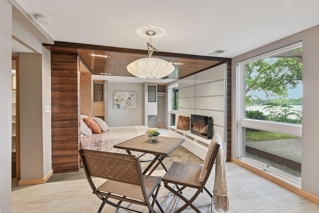 5016 Shady Oak Rd S, Minnetonka, MN 55343 - dining area featuring baseboards and a fireplace