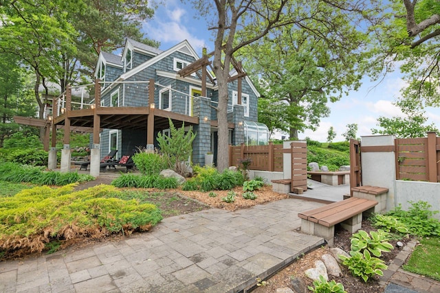 5016 Shady Oak Rd S, Minnetonka, MN 55343 - rear view of house with a patio area and a wooden deck