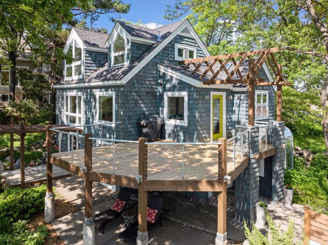 5016 Shady Oak Rd S, Minnetonka, MN 55343 - rear view of house with roof with shingles and a deck
