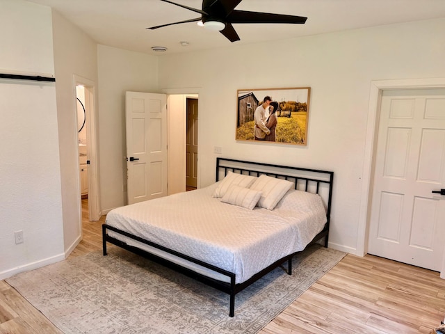 1622 82nd Ave NW, Williams, MN 56686 - bedroom with light wood-style flooring, baseboards, and ceiling fan