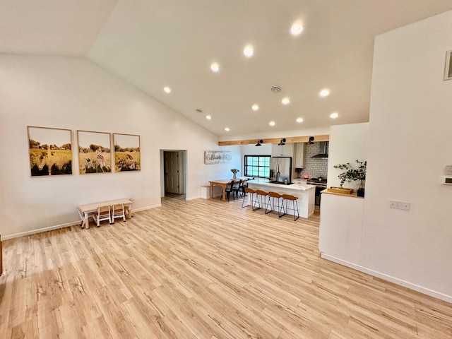 1622 82nd Ave NW, Williams, MN 56686 - living area with recessed lighting, light wood finished floors, high vaulted ceiling, and baseboards
