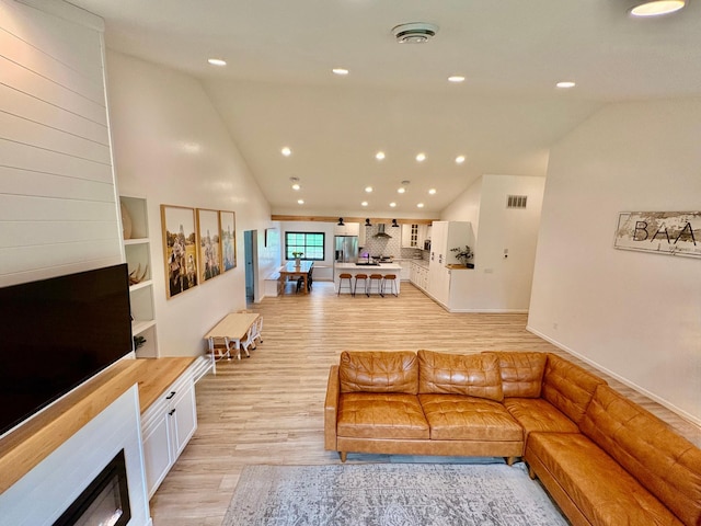1622 82nd Ave NW, Williams, MN 56686 - living area with light wood-style floors, recessed lighting, high vaulted ceiling, and baseboards