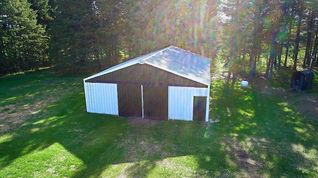 1622 82nd Ave NW, Williams, MN 56686 - view of pole building with a yard and a wooded view