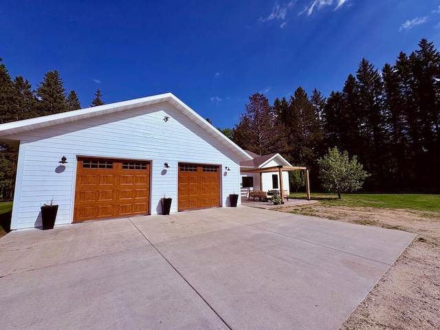 1622 82nd Ave NW, Williams, MN 56686 - view of side of home with a detached garage and an outbuilding