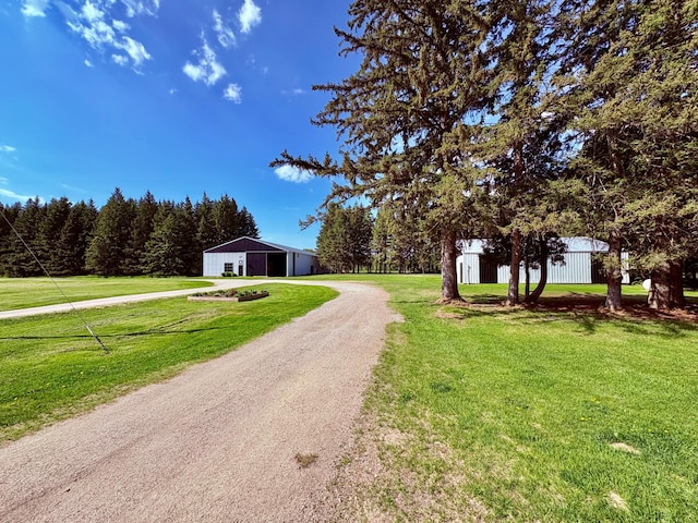 1622 82nd Ave NW, Williams, MN 56686 - view of dirt / gravel driveway featuring a pole building