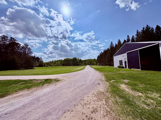 1622 82nd Ave NW, Williams, MN 56686 - view of street with an outbuilding and a view of trees