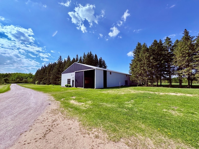 1622 82nd Ave NW, Williams, MN 56686 - view of pole building featuring a yard and driveway