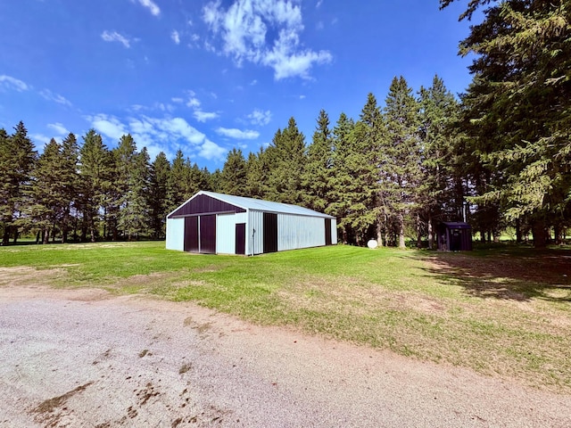1622 82nd Ave NW, Williams, MN 56686 - view of pole building featuring a lawn