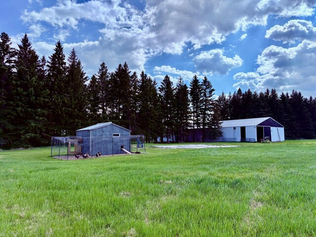1622 82nd Ave NW, Williams, MN 56686 - view of grassy yard featuring an outdoor structure and exterior structure