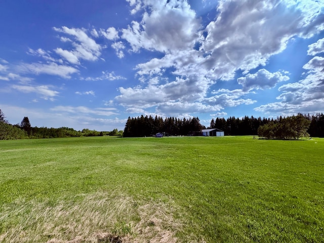 1622 82nd Ave NW, Williams, MN 56686 - view of green lawn with a view of countryside
