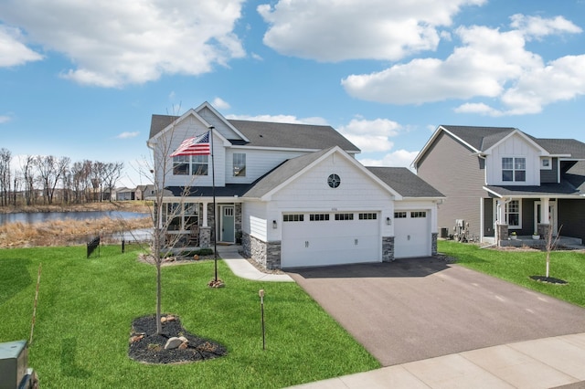 4356 128th Ln NE, Blaine, MN 55449 - craftsman inspired home featuring an attached garage, driveway, a front yard, and covered porch