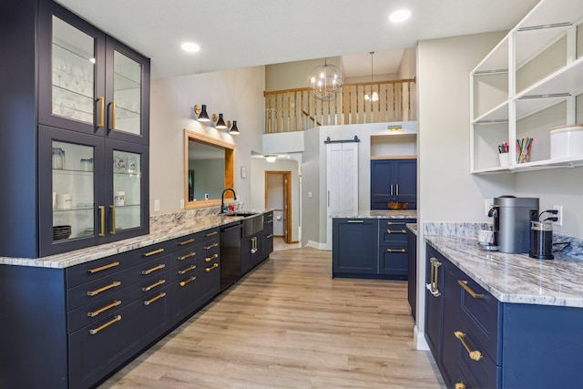 16905 Jalisco Ter W, Lakeville, MN 55044 - kitchen featuring blue cabinets, black dishwasher, open shelves, light wood-style floors, and glass insert cabinets