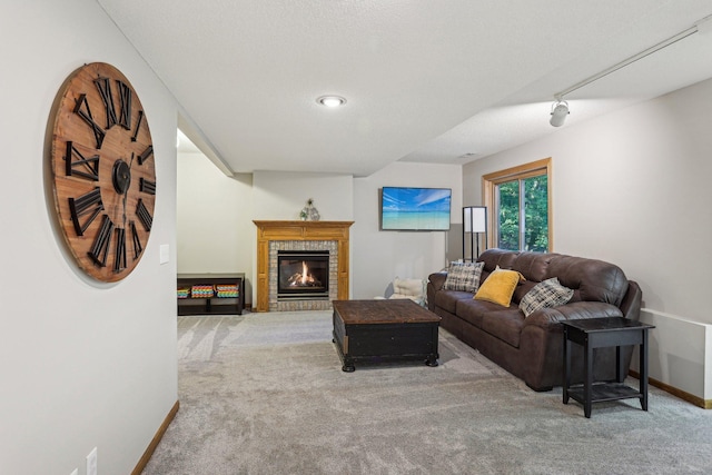 16905 Jalisco Ter W, Lakeville, MN 55044 - carpeted living area with baseboards and a brick fireplace