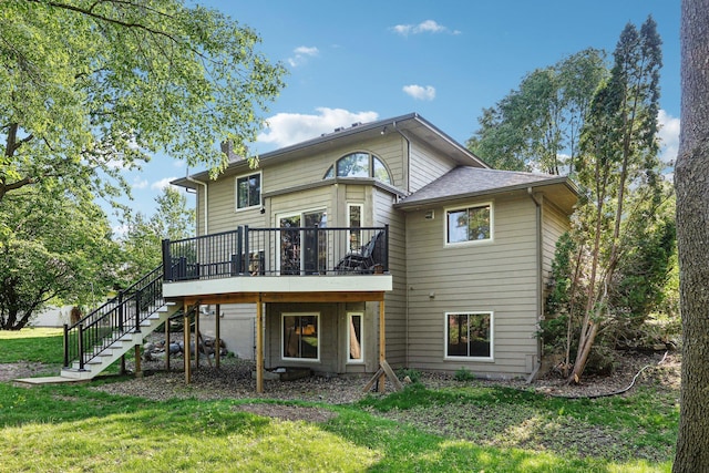 16905 Jalisco Ter W, Lakeville, MN 55044 - back of property featuring stairway, a lawn, and a wooden deck
