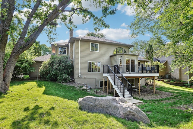 16905 Jalisco Ter W, Lakeville, MN 55044 - rear view of property with stairs, a wooden deck, a yard, and a chimney